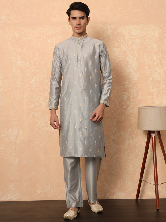 Steel grey kurta set with golden thread work butta and collar.