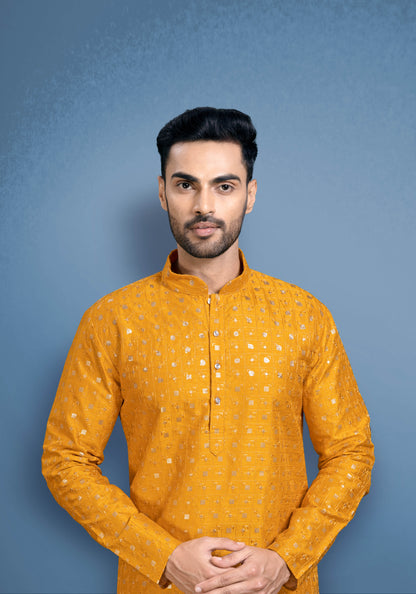 Yellow silky kurta with golden sequencing.